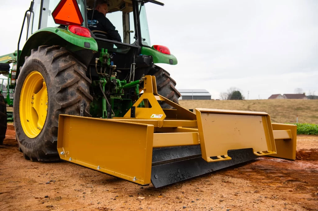 Land leveler and grader blade attachment for surface leveling